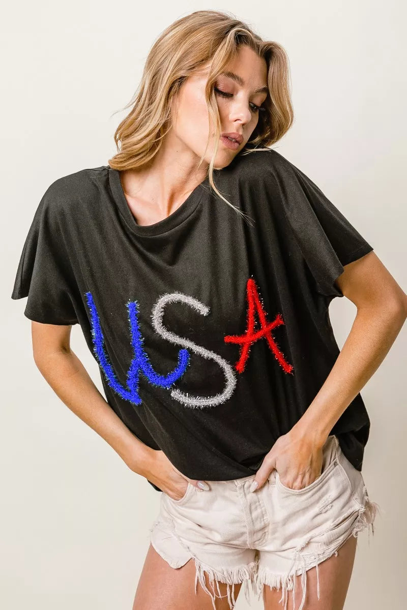 BiBi Metallic Letter Short Dolman Sleeve Top - Lee's Retail