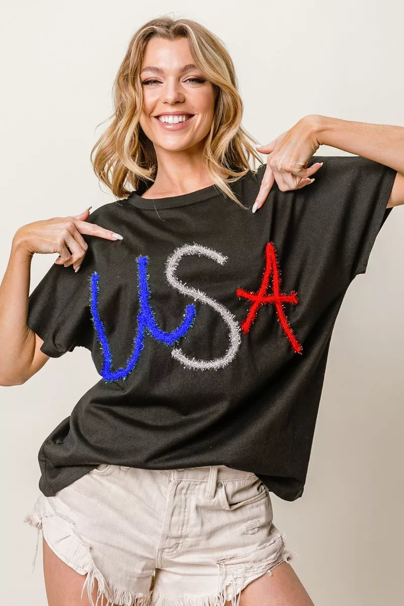 BiBi Metallic Letter Short Dolman Sleeve Top - Lee's Retail